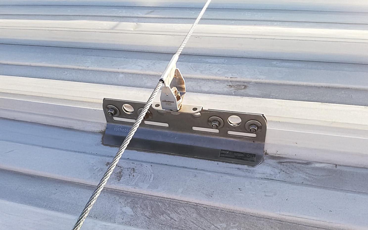 Industrial rooftop fall protection system with anchors, guardrails, and ladder access in Ontario commercial facility