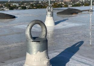 Roof anchor fall protection system installed on industrial rooftop in Ontario for safety and compliance inspections